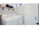 Laundry room with washer, dryer, and extra storage at 5625 Chipola Cir, Orlando, FL 32839