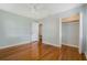 Spacious bedroom featuring hardwood floors and ample closet space at 5625 Chipola Cir, Orlando, FL 32839