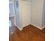 Hallway with wood flooring and closet at 5625 Chipola Cir, Orlando, FL 32839
