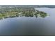 Aerial view showcasing lakefront property and neighborhood at 5625 Chipola Cir, Orlando, FL 32839