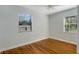 Bedroom with hardwood floors and two windows at 5625 Chipola Cir, Orlando, FL 32839