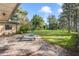 Brick patio with lounge chairs and lake view at 5625 Chipola Cir, Orlando, FL 32839