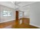 Hardwood floors and ceiling fan in spacious living room at 5625 Chipola Cir, Orlando, FL 32839