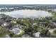 Wide aerial view of the property and lake at 5625 Chipola Cir, Orlando, FL 32839