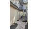 Exterior view showing a stairway to a deck and storage area at 5625 Chipola Cir, Orlando, FL 32839