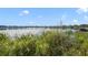 Serene lakefront view with dock at 5625 Chipola Cir, Orlando, FL 32839