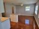 Living room with hardwood floors and access to kitchen at 5625 Chipola Cir, Orlando, FL 32839