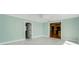 Gathering room with view into kitchen and access to other rooms at 5625 Chipola Cir, Orlando, FL 32839