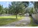 House with a large grassy front yard and mature trees at 5625 Chipola Cir, Orlando, FL 32839