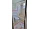 Bathroom with pink tile, bathtub, and updated vanity at 5625 Chipola Cir, Orlando, FL 32839