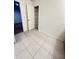 Laundry room with shelving and tile floor at 420 Quarry Rock Cir, Kissimmee, FL 34758