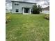 Two-story house with a backyard and covered patio at 420 Quarry Rock Cir, Kissimmee, FL 34758