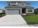 Two story house with attached garage and landscaping at 420 Quarry Rock Cir, Kissimmee, FL 34758