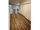Bright entryway with wood-look flooring and views into the living room and kitchen at 420 Quarry Rock Cir, Kissimmee, FL 34758