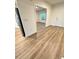 Inviting entryway with wood-look floors leading to living area at 420 Quarry Rock Cir, Kissimmee, FL 34758