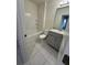 Clean bathroom with tub, toilet and grey vanity at 420 Quarry Rock Cir, Kissimmee, FL 34758