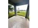 Spacious covered patio with a view of the lake and neighborhood at 420 Quarry Rock Cir, Kissimmee, FL 34758