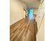Spacious entryway with wood-look floors, leading to living areas and stairs at 420 Quarry Rock Cir, Kissimmee, FL 34758