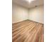 Well-lit bedroom with double doors and wood-look flooring at 420 Quarry Rock Cir, Kissimmee, FL 34758
