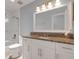 Updated bathroom with granite countertop and white cabinets at 7904 Dunstable Cir, Orlando, FL 32817