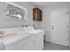 Laundry room with washer, dryer, and storage cabinet at 7904 Dunstable Cir, Orlando, FL 32817