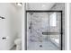Bathroom with marble shower, modern fixtures, and a separate toilet area at 7904 Dunstable Cir, Orlando, FL 32817