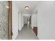 Bright entryway with gray tile floor and view to living room at 7904 Dunstable Cir, Orlando, FL 32817