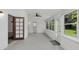Sunroom features tile floors, multiple windows and access to backyard at 7904 Dunstable Cir, Orlando, FL 32817