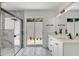 Spa-like bathroom with marble shower, dual vanity, and modern fixtures at 7904 Dunstable Cir, Orlando, FL 32817