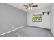 Bedroom with grey walls, carpet, and a window at 7904 Dunstable Cir, Orlando, FL 32817