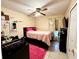 Bedroom with a bed, dresser, and pink rug at 2108 Shannon Lakes Blvd, Kissimmee, FL 34743