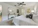Spacious bedroom with large bed, ceiling fan, and ample natural light at 812 Shell Ln, Longwood, FL 32750