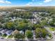 Aerial view of a residential neighborhood with houses, trees, and roads at 812 Shell Ln, Longwood, FL 32750