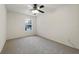 Simple bedroom with ceiling fan and neutral colored carpet at 812 Shell Ln, Longwood, FL 32750