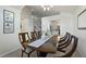 Open dining room with a large table, hardwood floors, and views to the kitchen at 812 Shell Ln, Longwood, FL 32750