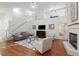 Two-story living room with hardwood floors, fireplace and loft area at 812 Shell Ln, Longwood, FL 32750