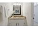 Clean and updated half bathroom with granite vanity and white cabinets at 812 Shell Ln, Longwood, FL 32750