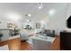 Open living room with hardwood floors, vaulted ceilings, and a cozy seating area at 812 Shell Ln, Longwood, FL 32750