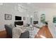 Spacious living room with hardwood floors, fireplace, and high ceilings at 812 Shell Ln, Longwood, FL 32750