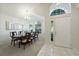 Elegant dining room featuring a large table, hardwood floors, and an abundance of natural light at 812 Shell Ln, Longwood, FL 32750