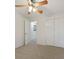 Well-lit bedroom with double door closet and access to hallway at 812 Shell Ln, Longwood, FL 32750
