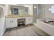 Elegant bathroom with double vanity, granite countertop, and large soaking tub at 812 Shell Ln, Longwood, FL 32750
