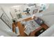 Open floor plan with hardwood floors, kitchen, living room, and stairs at 812 Shell Ln, Longwood, FL 32750