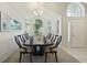 Spacious dining area with a large table and chairs, hardwood floors and large windows at 812 Shell Ln, Longwood, FL 32750