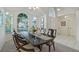 Bright dining room with a large table and chairs, hardwood floors, and natural light at 812 Shell Ln, Longwood, FL 32750