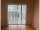 Living area with sliding doors leading to a deck at 6088 Westgate Dr # 203, Orlando, FL 32835