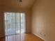 Living room with sliding doors to deck and hardwood floors at 6088 Westgate Dr # 203, Orlando, FL 32835