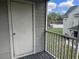 Screened balcony with storage closet and partial community view at 6088 Westgate Dr # 203, Orlando, FL 32835