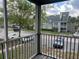 Screened balcony with view of the community and parking area at 6088 Westgate Dr # 203, Orlando, FL 32835