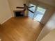 Bright living room with hardwood floors, fireplace, and access to a private deck at 6088 Westgate Dr # 203, Orlando, FL 32835